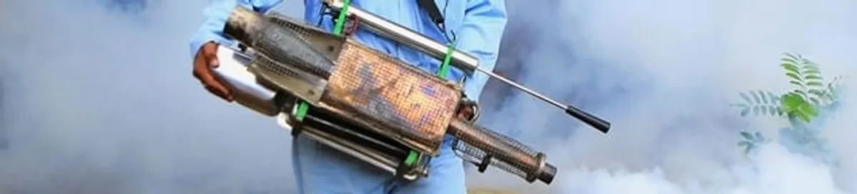 Fumigation technician using a fogger for deep pest treatment in Mobile, AL